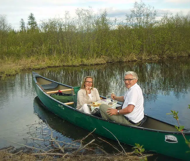 couple lunching in canoe