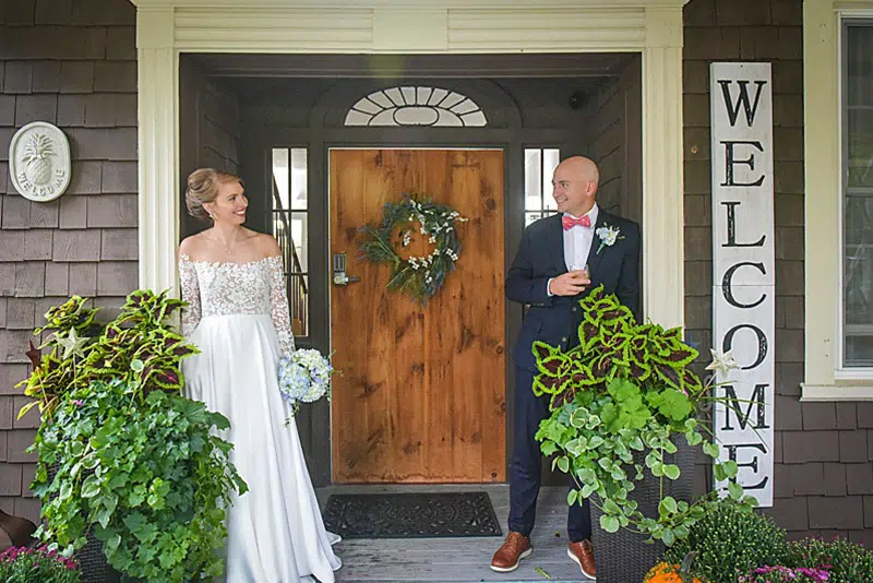 bride and groom on porch