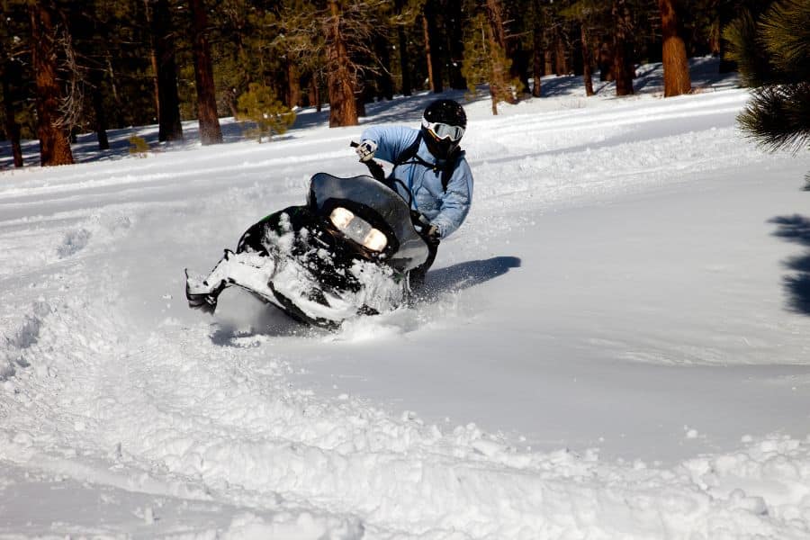 person snowmobiling