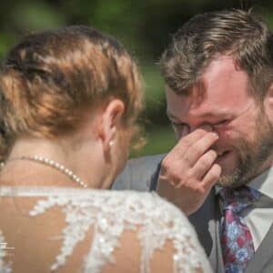man crying happy tears during his elopement