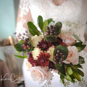 upclose of a woman holding a beautiful elopement bouquet
